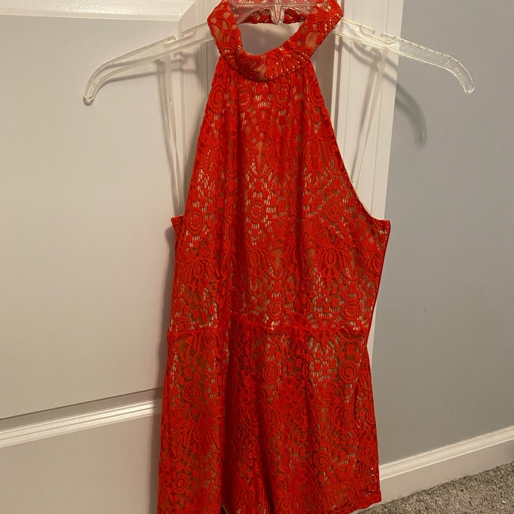 Romper, halter style with open back. Shorts